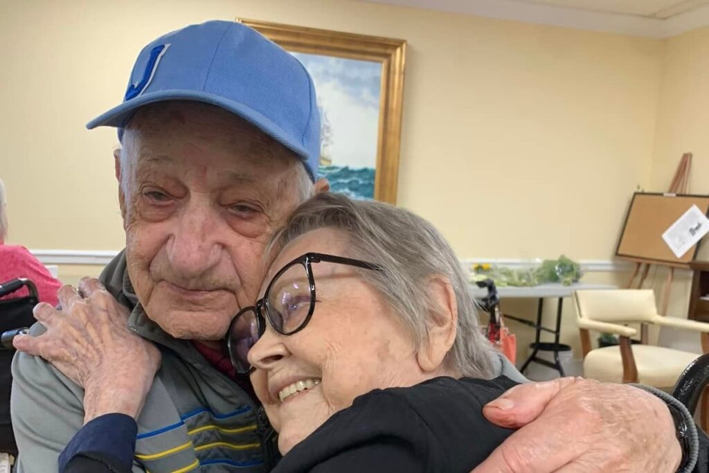 Williamsburg Landing | Senior resident and family member hugging
