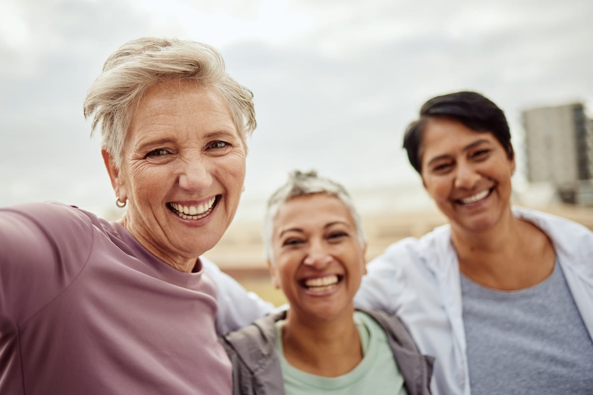 Williamsburg Landing | Senior woman taking a selfie outside