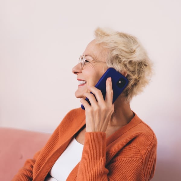 Golden Bell Senior Living | Senior woman calling the community
