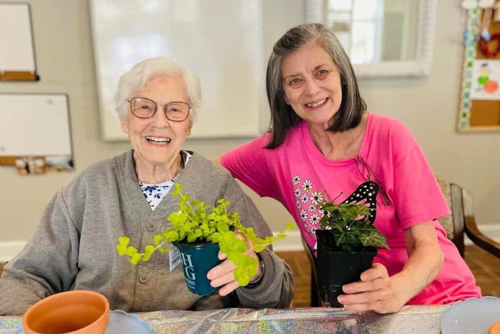 Cumberland Hills Assisted Living | Two residents at an assisted living facility potting plants