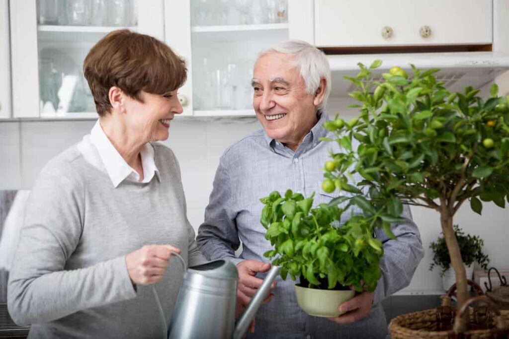 Cumberland Village Independent Living | Senior Couple Watering Potted Plants